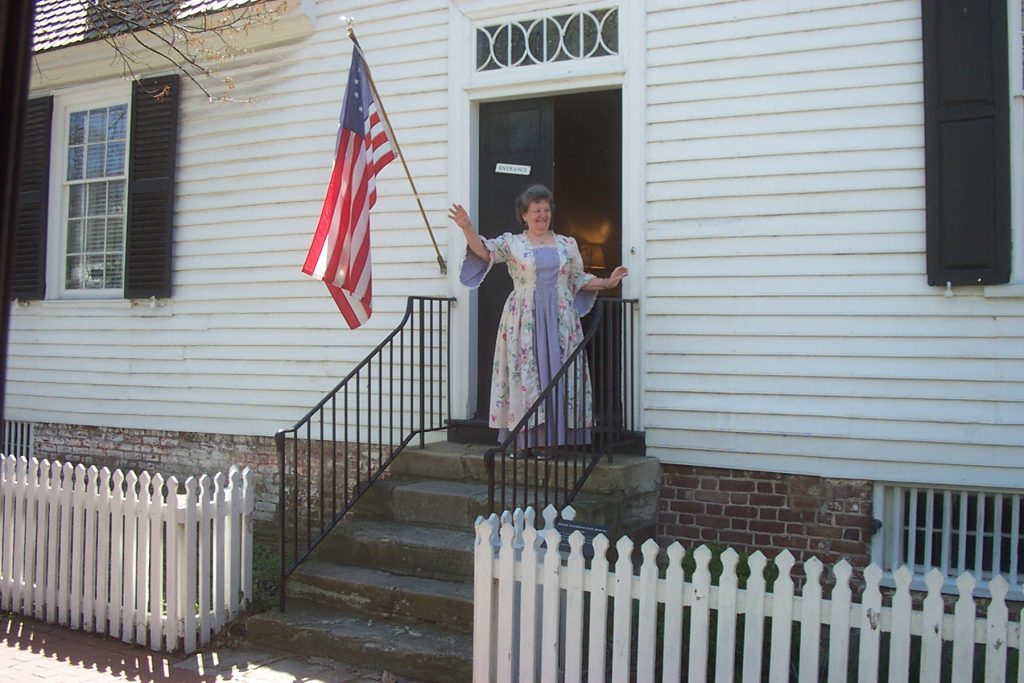 Docent Waving from the Mary Washington House Docent Waving from the Mary Washington House