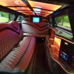 Luxurious Limo Interior with Brown Diamond-stitched Leather Seats and Blue/orange Ambient Lighting. Luxurious Limo Interior with Brown Diamond-stitched Leather Seats and Blue/orange Ambient Lighting.